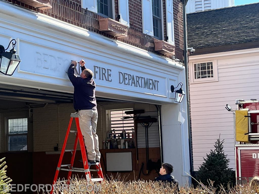 Jim Best taking down the signage
